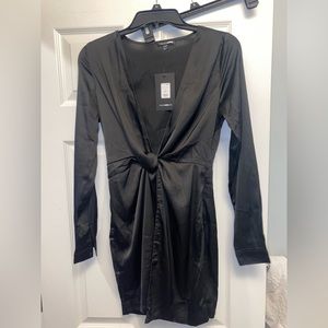 Black long sleeve low cut twist dress